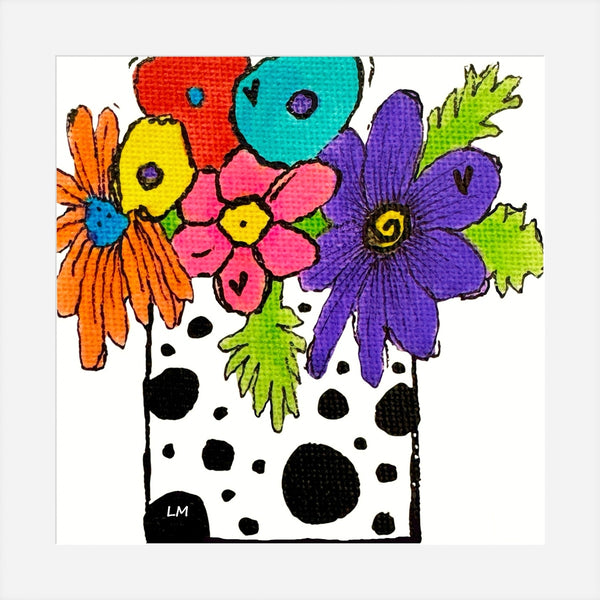 Colorful floral arrangement with a black and white polka dot pattern on a white background