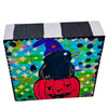 Halloween painting on a wood block and the sides are all painted with black and white stripes