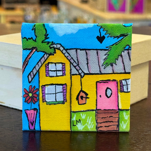 colorful whimsical house with palm trees