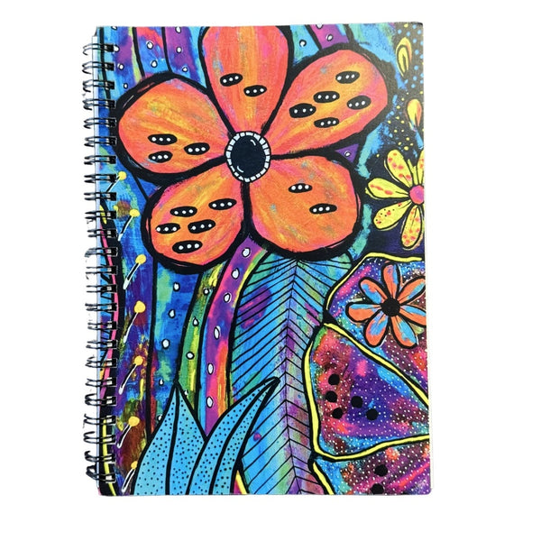 Colorful notebook with a floral design on a white background