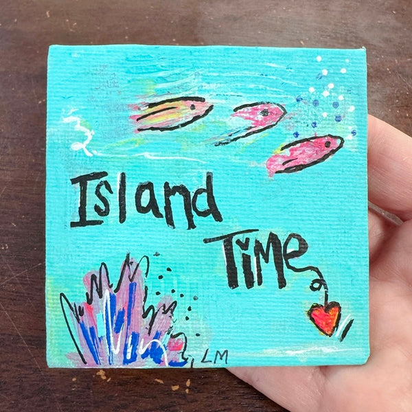 art magnet in blue with small fish and written "island time"
