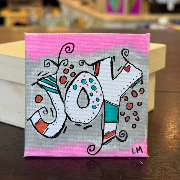square art magnet with the word joy