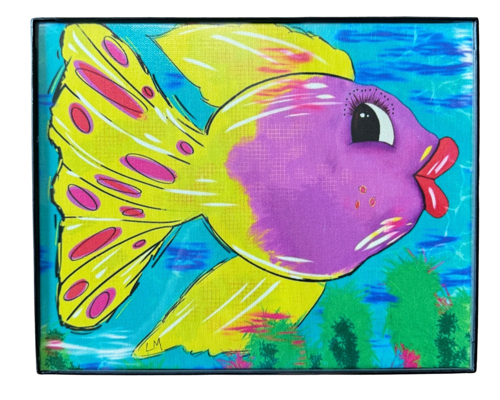 colorful tropical fish art in a black frame on a white wall