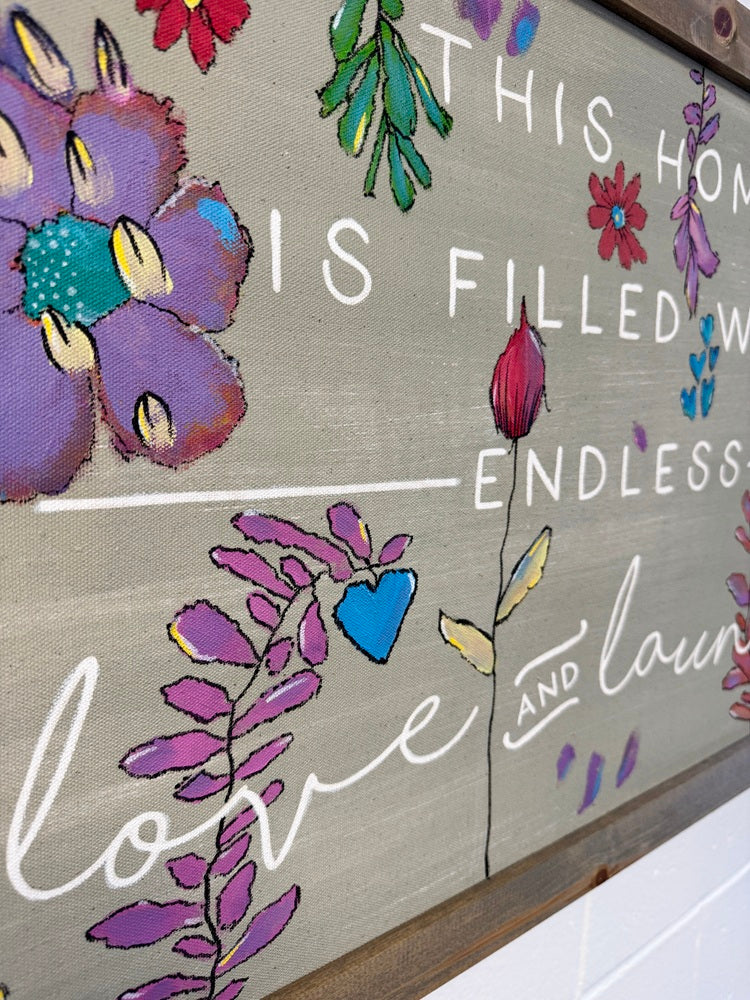Decorative wall art with floral designs and text on a neutral background