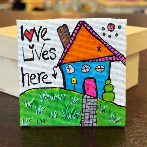 whimsical house saying "Love lives here"