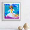 Framed artwork of angel with a yellow heart on a blue background, displayed on a white wall with decorative vases.