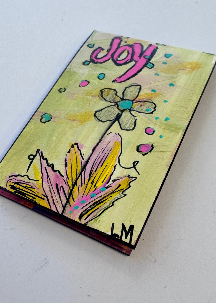 small painting with a flower and the word 'joy'