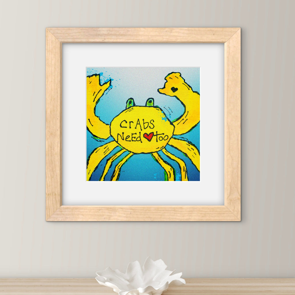 yellow crab artwork with text saying "crabs need love too" with a matted frame