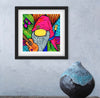 Framed colorful artwork of a gnome playing guitar on a gray wall with a textured surface.