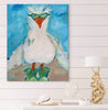 Painting of a seagull bird with sunglasses on a wall above a shelf with decorative items.