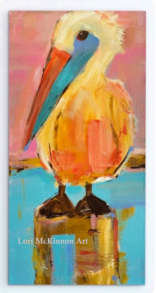 colorful pelican art print on a gallery wrapped canvas against a white wall