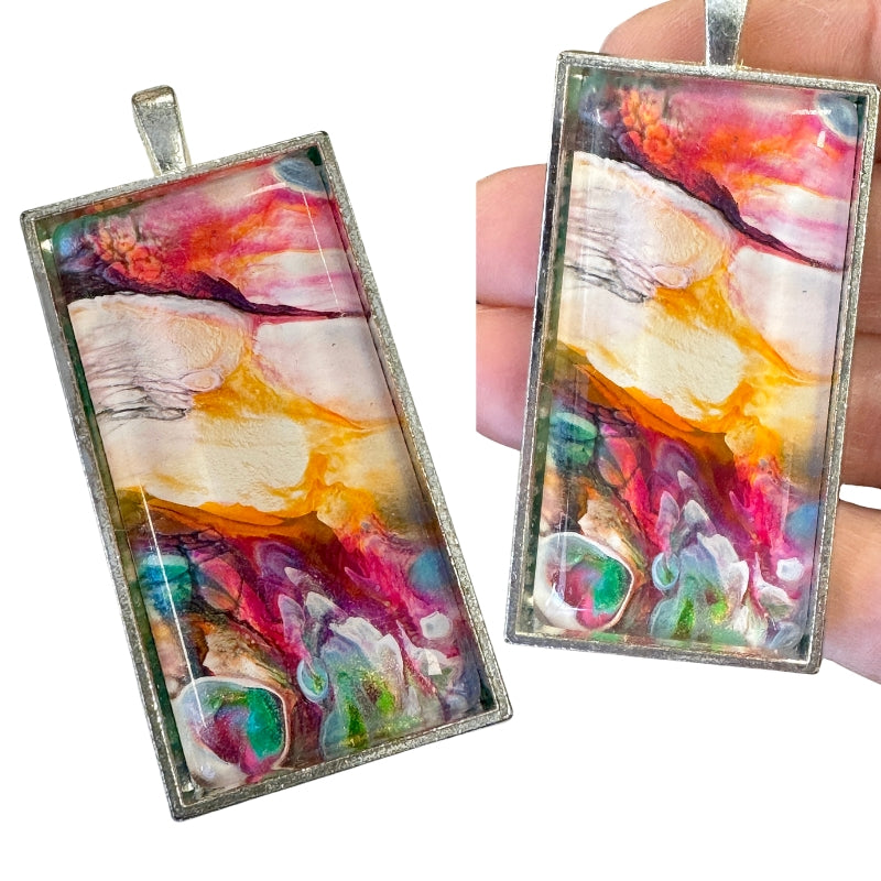 painted glass pendant with silver tray setting