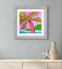 Art print of a colorful palm tree on a pink background