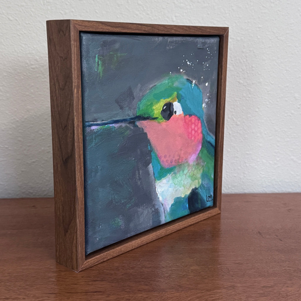 an angled view of a framed painting showing the sides of the frame