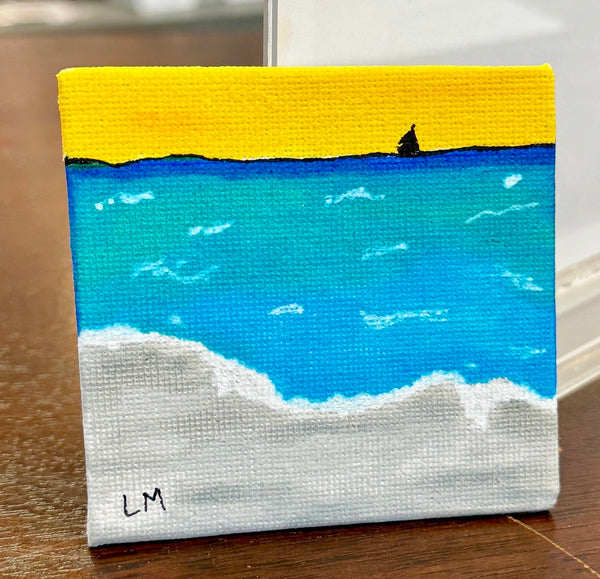 small artwork with sand, ocean and small boat at sunset
