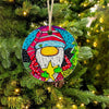 Colorful Santa gnome ornament hanging on a Christmas tree