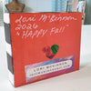whimsical scarecrow artwork signed on the back with the artist's information, Lori McKinnon