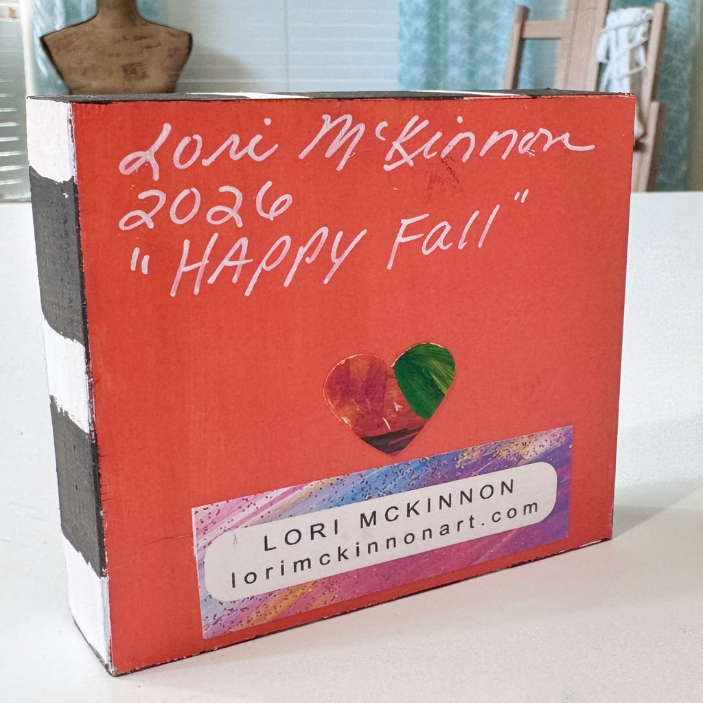 whimsical scarecrow artwork signed on the back with the artist's information, Lori McKinnon