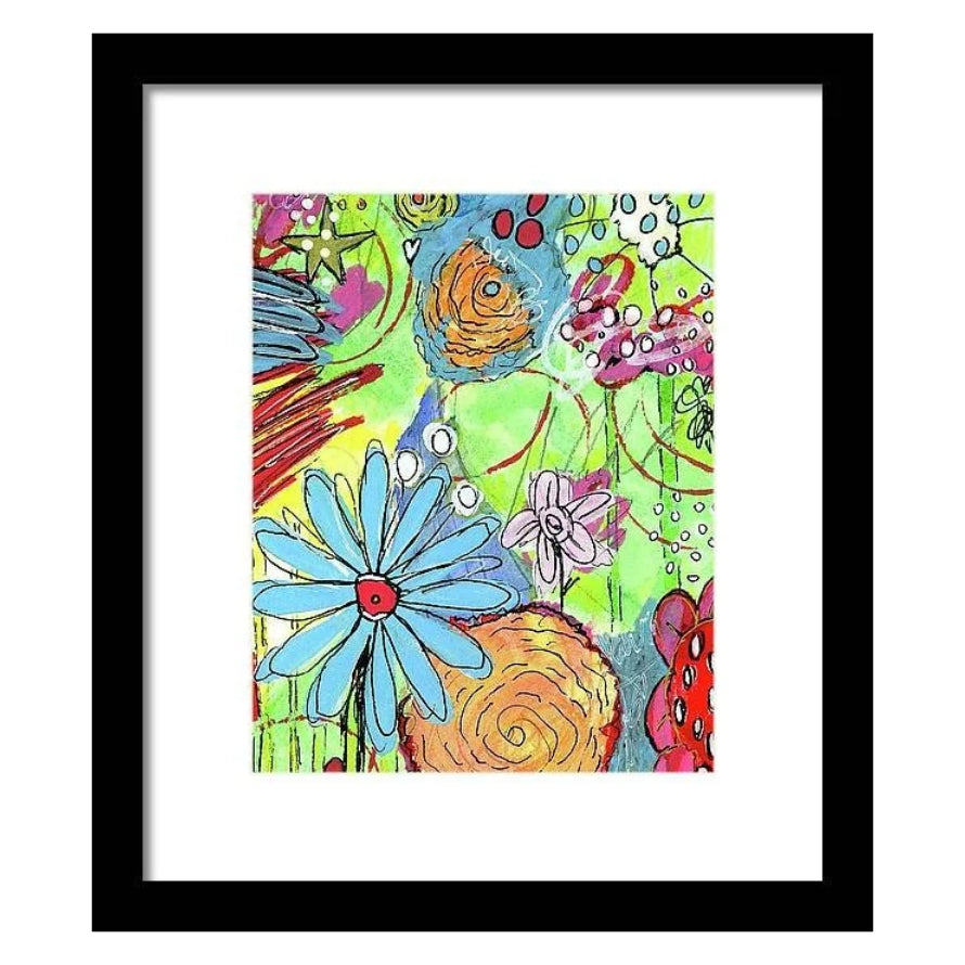 Framed abstract floral art print with a black frame and white mat. The artwork features a vibrant, multicolored abstract design with blue daisies, pink flowers, orange swirls, and green, yellow, and red background textures.