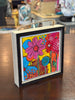 floral painting in wood frame