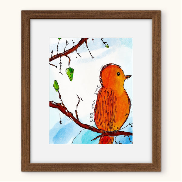 Framed artwork of a bird on a branch with a blue background