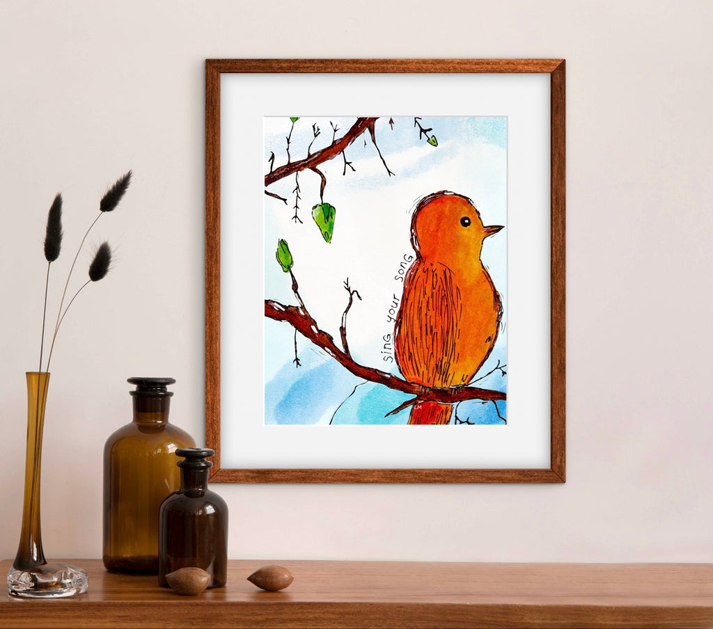 framed artwork of bird on a brach above a table with flowers and vases on it