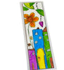 A rectangular bookmark that is laminated with rounded corners, featuring a colorful hand-drawn illustration of stylized houses, a large orange flower, green leaves, and a purple heart on a white background.