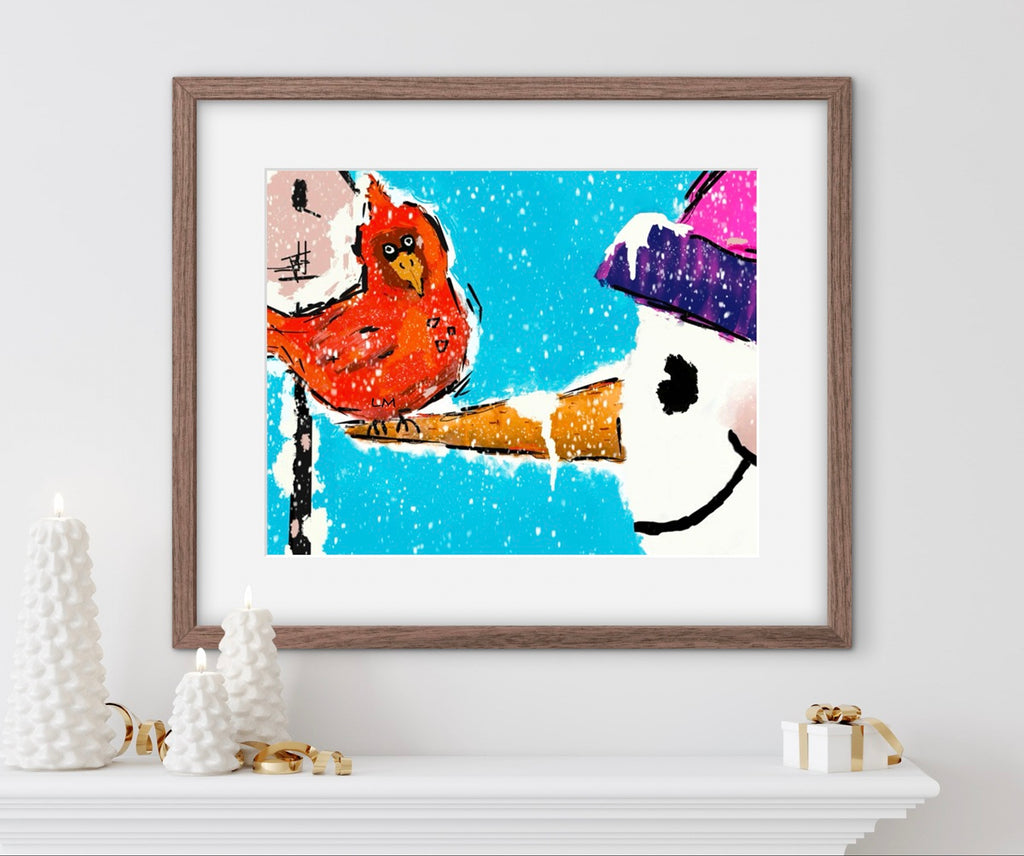 Framed artwork of a bird and snowman on a white wall with decorative items below.
