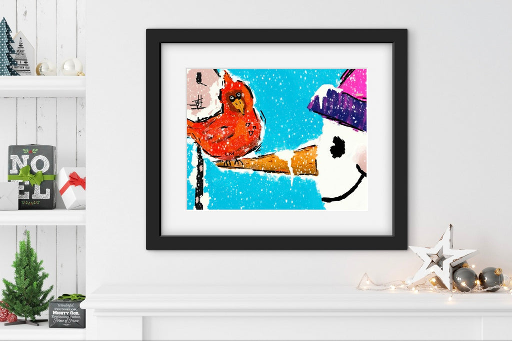 Framed artwork of a bird on the nose of a whimsical snowman with a snowy background, displayed on a white shelf.