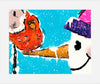 Red bird on a the nose of a whimsical snowman