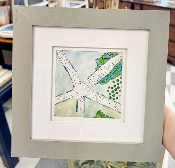 Framed artwork with a starfish