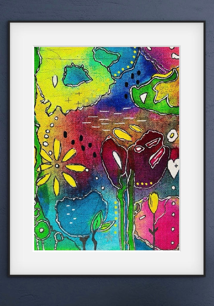 Framed colorful abstract artwork with flowers on a dark background