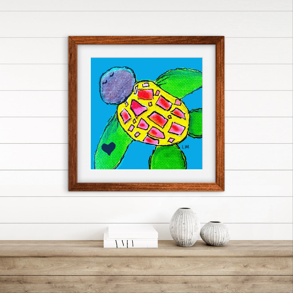 Framed artwork of a colorful turtle on a white wall with wooden shelf.