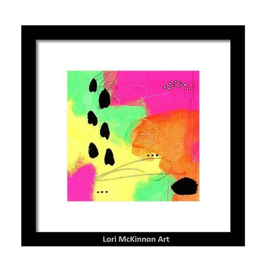 abstract art print in vibrant colors with a black frame and white mat hanging on a white wall