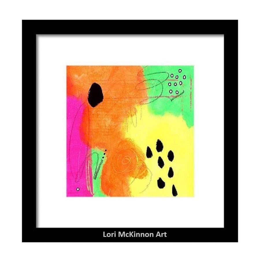 Framed abstract art print by Lori McKinnon, featuring a colorful composition of orange, yellow, green, and pink with black organic shapes and dotted lines, presented in a black frame with a white mat.