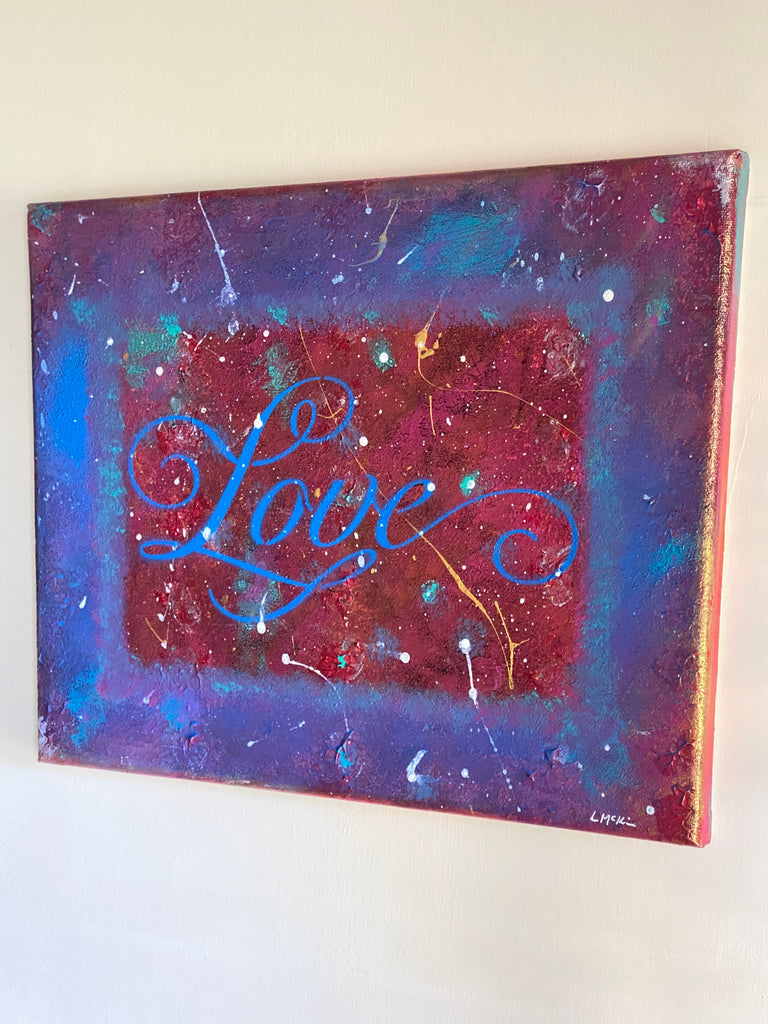 "Love" text abstract painting on a white wall